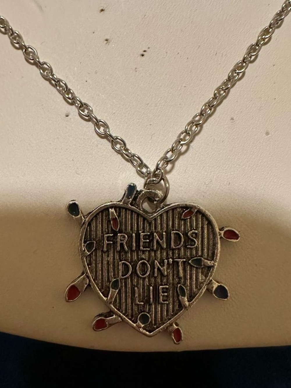 Stranger things Christmas lights “Friends don’t lie” silver tone necklace.